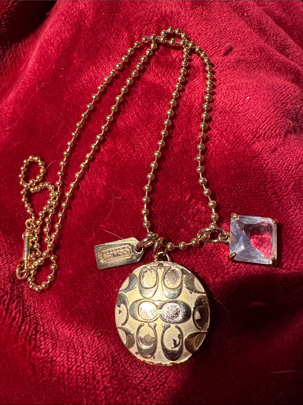 Coach vintage Gold-Tone Round Pendant Necklace with Clear Crystal Charm